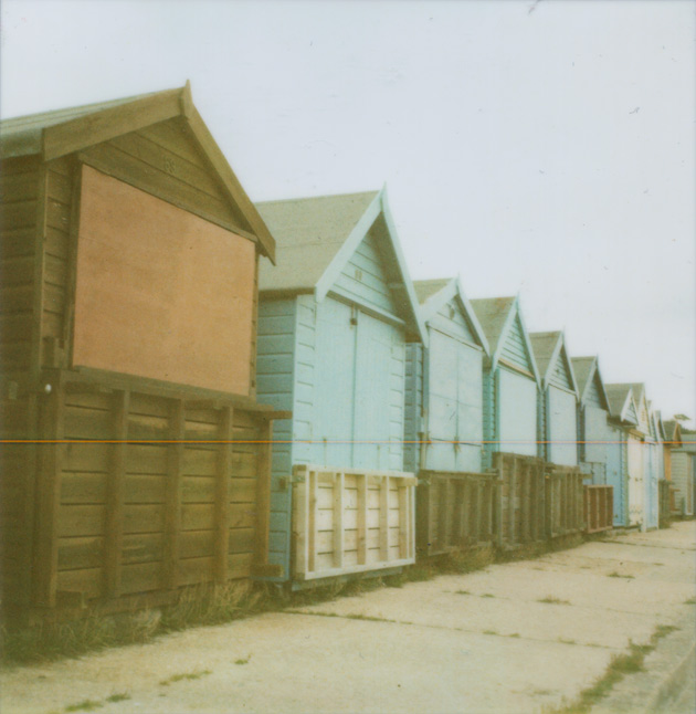 row of beach huts - Polaroid SX-70 row of beach huts - Polaroid SX-70